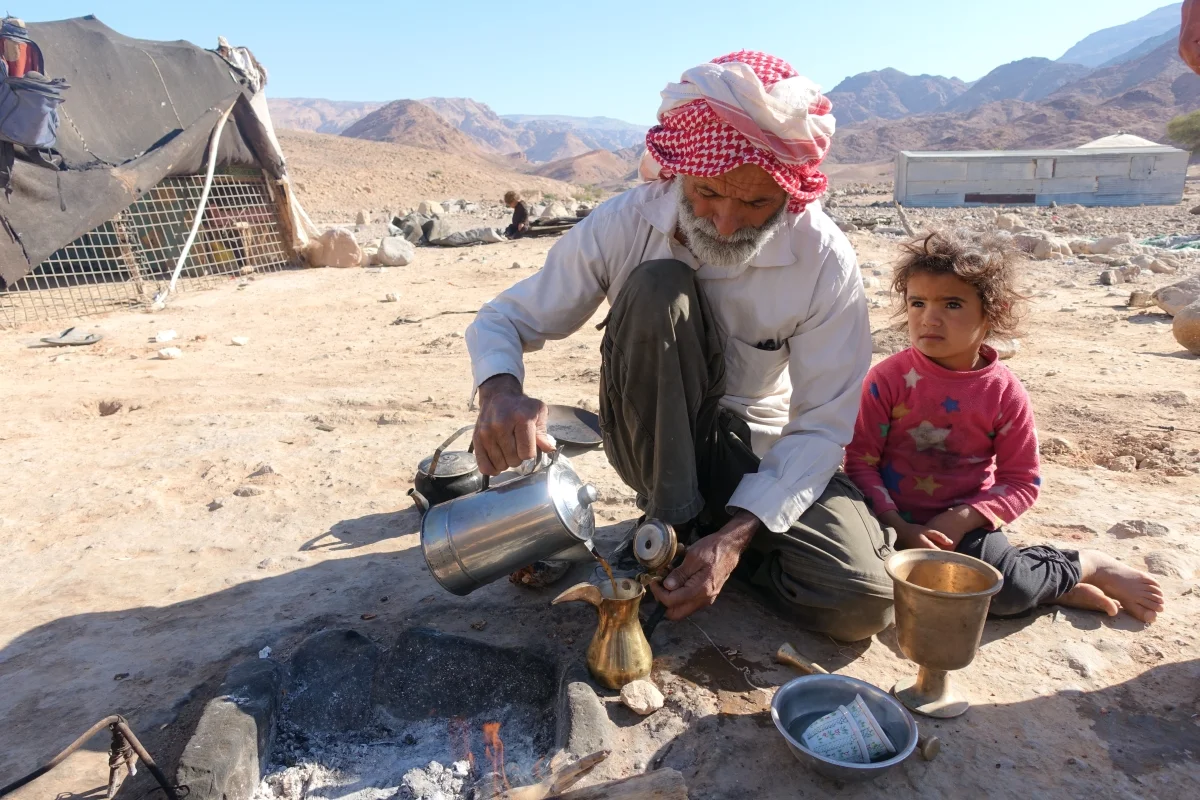 Traditional tea by the campfire in Jordan desert