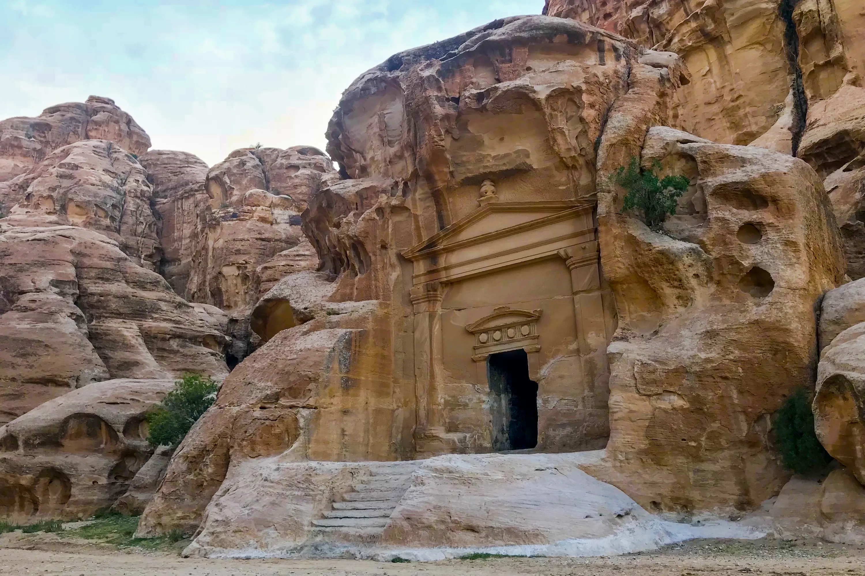 Little Petra travel photo with sandstone cliffs and ancient facades