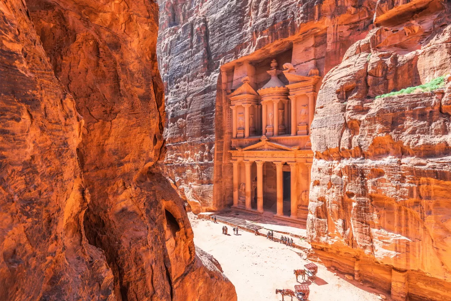 Historic rock cut tombs and mountain scenery in Petra Jordan