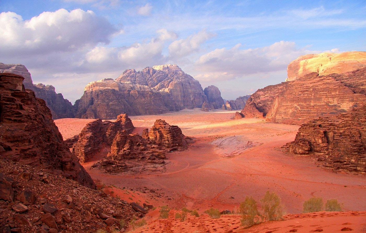 Panoramic desert view of Wadi Rum mountains and red sand